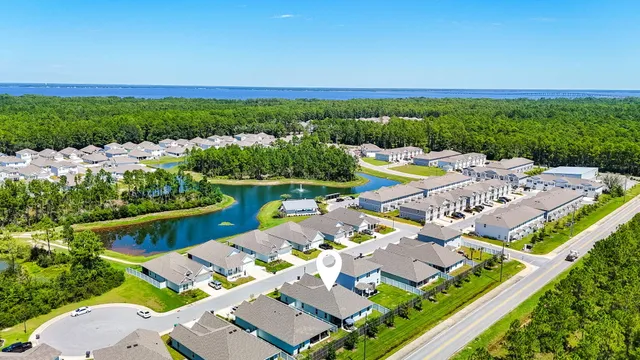 an aerial view of a house with a garden
