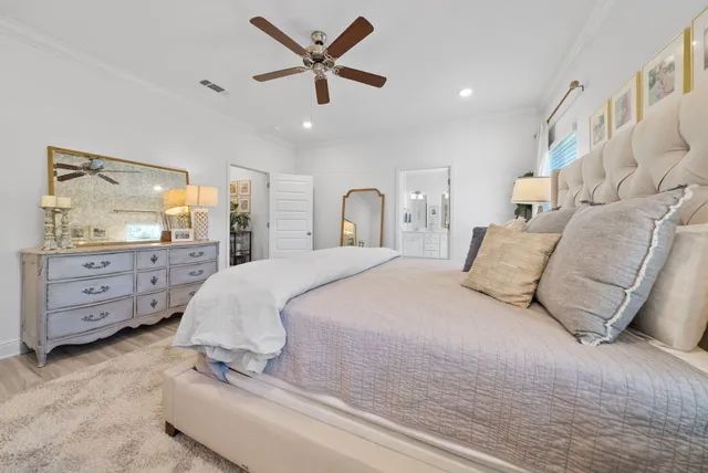 a bed room with a bed and a mirror