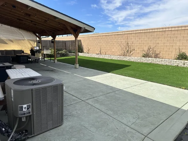 a view of yard with patio