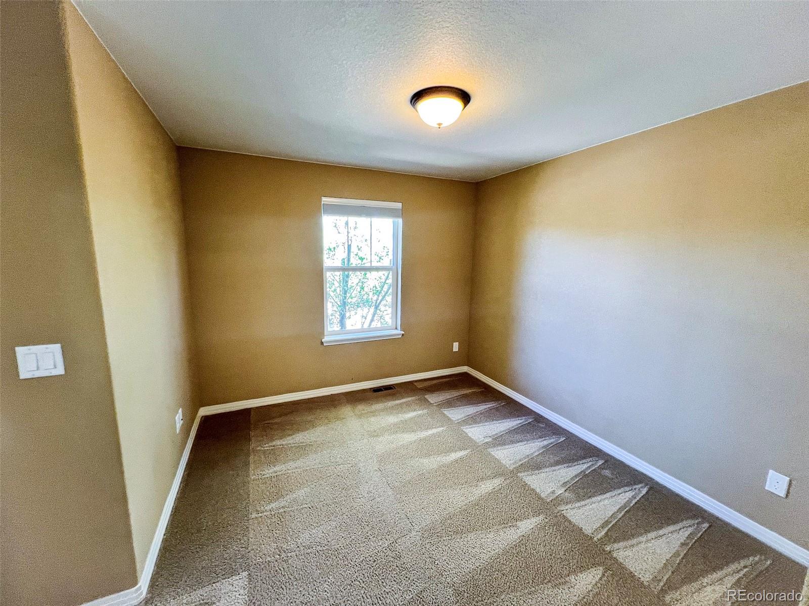 1524 Renaissance Drive Longmont, CO 80503 - Photo 12 of 23 an empty room with windows