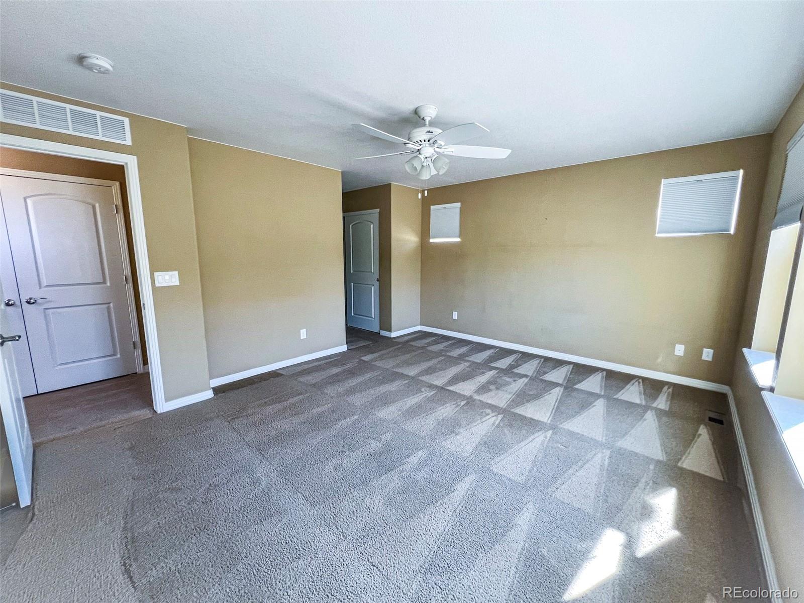 1524 Renaissance Drive Longmont, CO 80503 - Photo 16 of 23 an empty room with a mirror