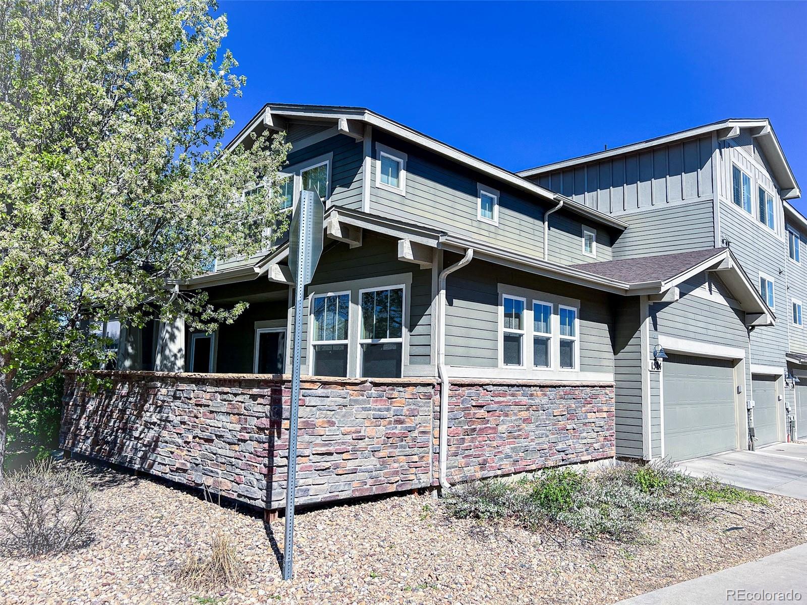 1524 Renaissance Drive Longmont, CO 80503 - Photo 3 of 23 a front view of a house with a yard