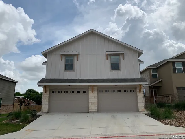a view of a house with backyard