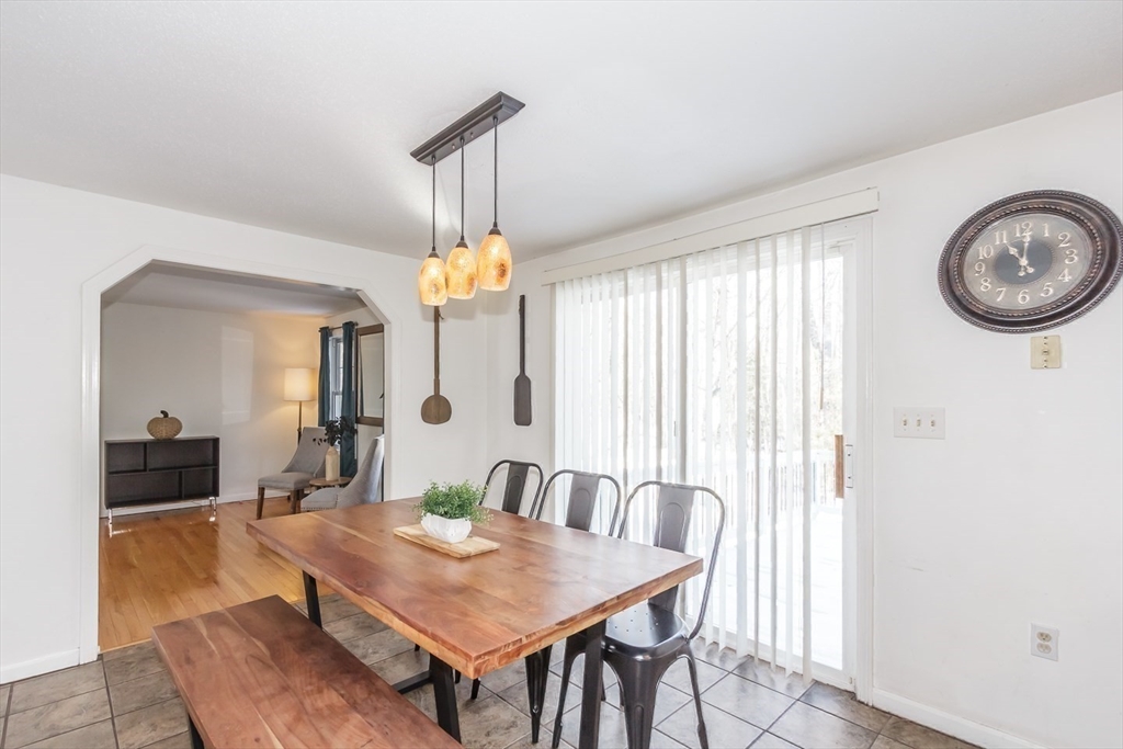 979 Hildreth Street Dracut, MA 01826 - Photo 12 of 39 a view of a dining room with furniture and chandelier