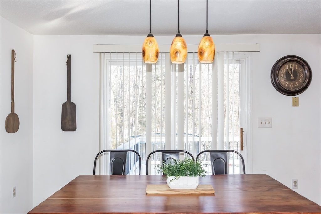 979 Hildreth Street Dracut, MA 01826 - Photo 13 of 39 a view of a dining area with furniture and chandelier