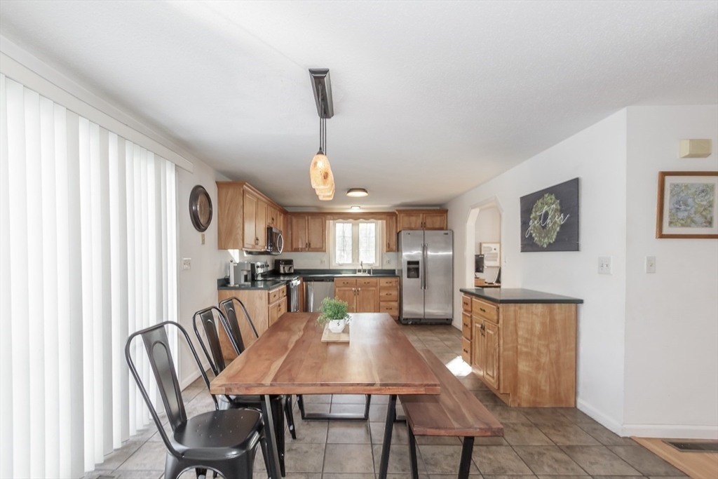 979 Hildreth Street Dracut, MA 01826 - Photo 15 of 39 a view of a dining room with furniture
