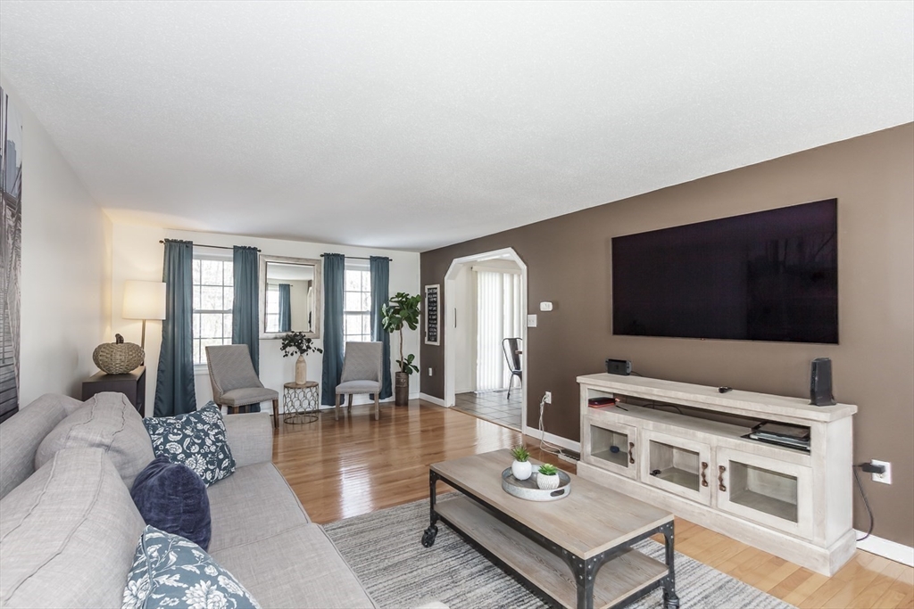979 Hildreth Street Dracut, MA 01826 - Photo 18 of 39 a living room with furniture and a flat screen tv