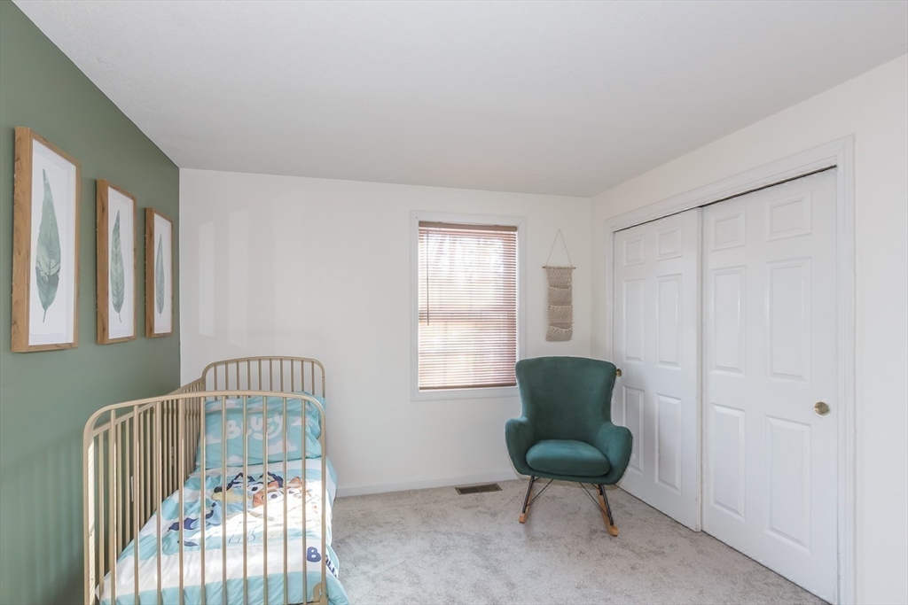 979 Hildreth Street Dracut, MA 01826 - Photo 23 of 39 a living room with furniture and a window
