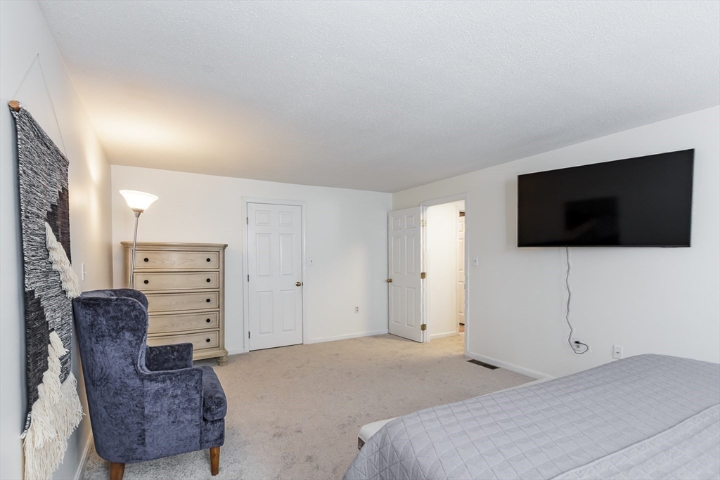 979 Hildreth Street Dracut, MA 01826 - Photo 29 of 39 a view of a livingroom with furniture and a flat screen tv