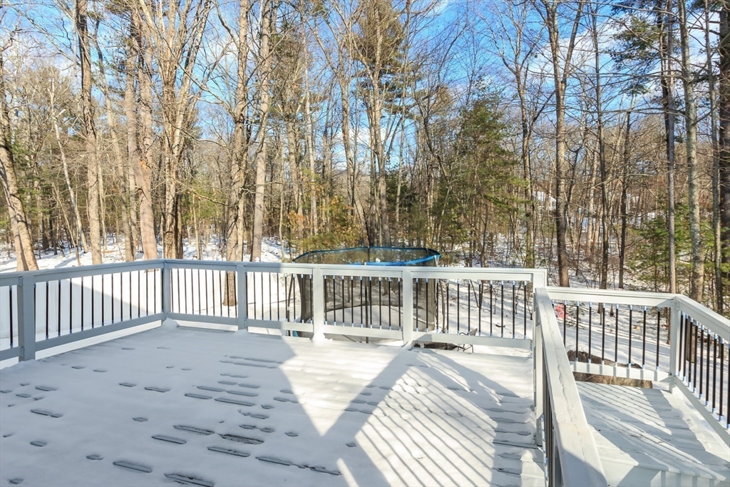 979 Hildreth Street Dracut, MA 01826 - Photo 34 of 39 a view of a wooden roof deck