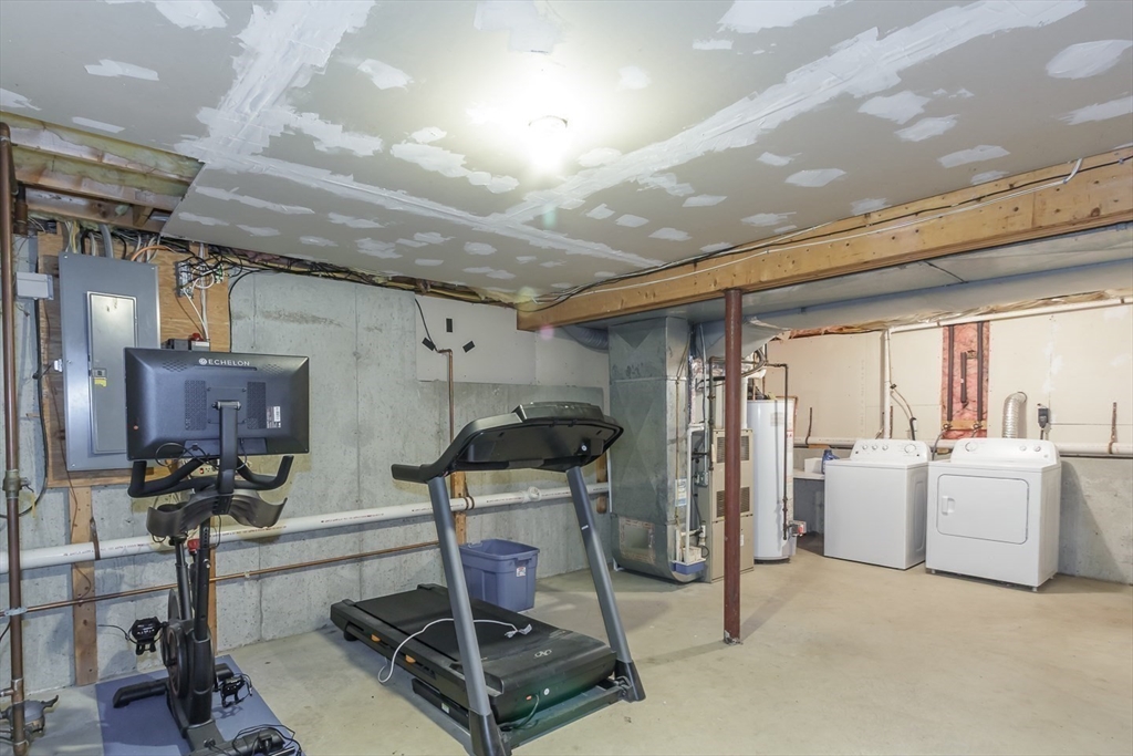 979 Hildreth Street Dracut, MA 01826 - Photo 35 of 39 a view of a room with gym equipment