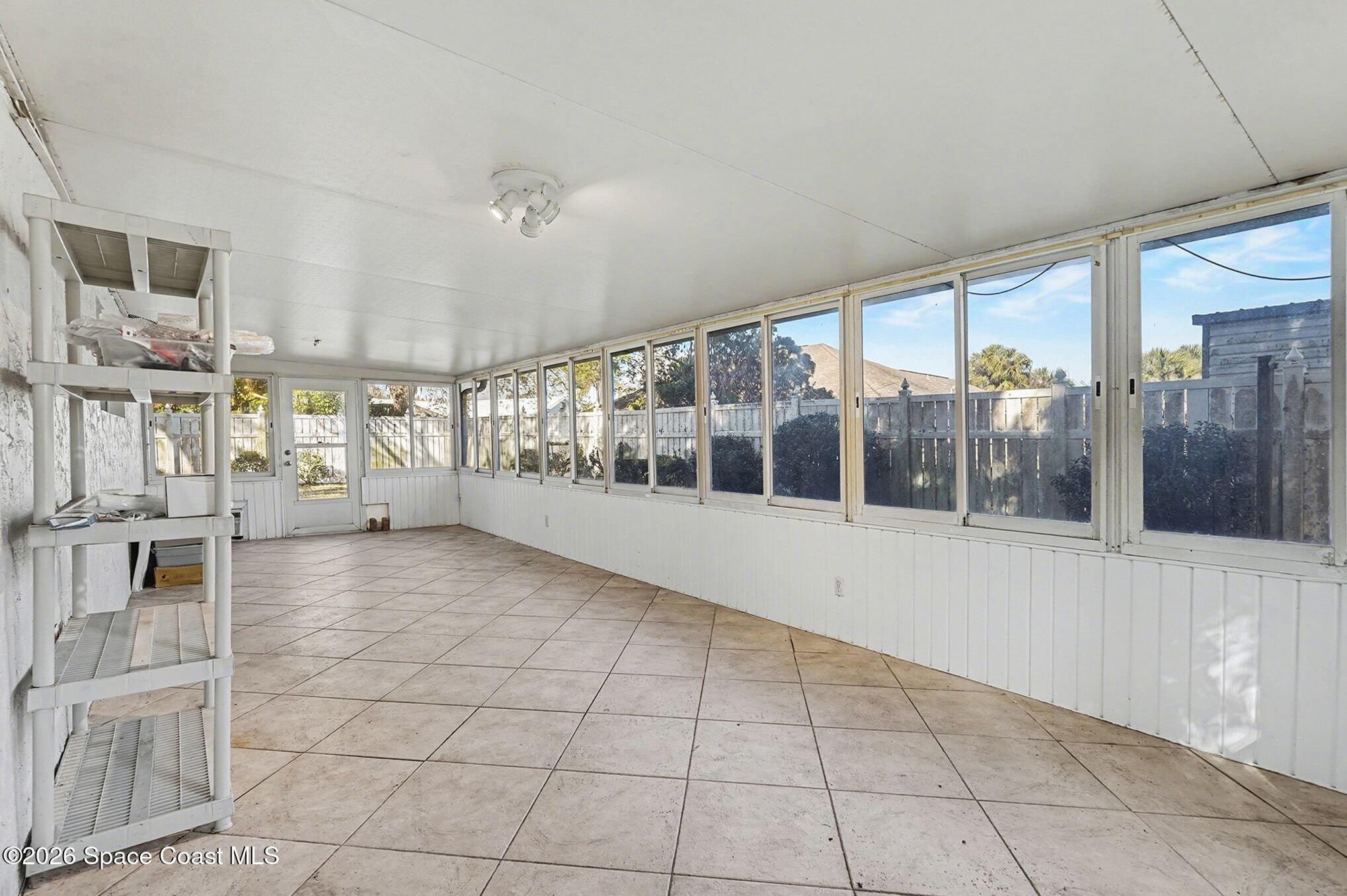 1351 Cherry Hills Road Northeast Palm Bay, FL 32905 - Photo 10 of 15 Large Screened-in Porch