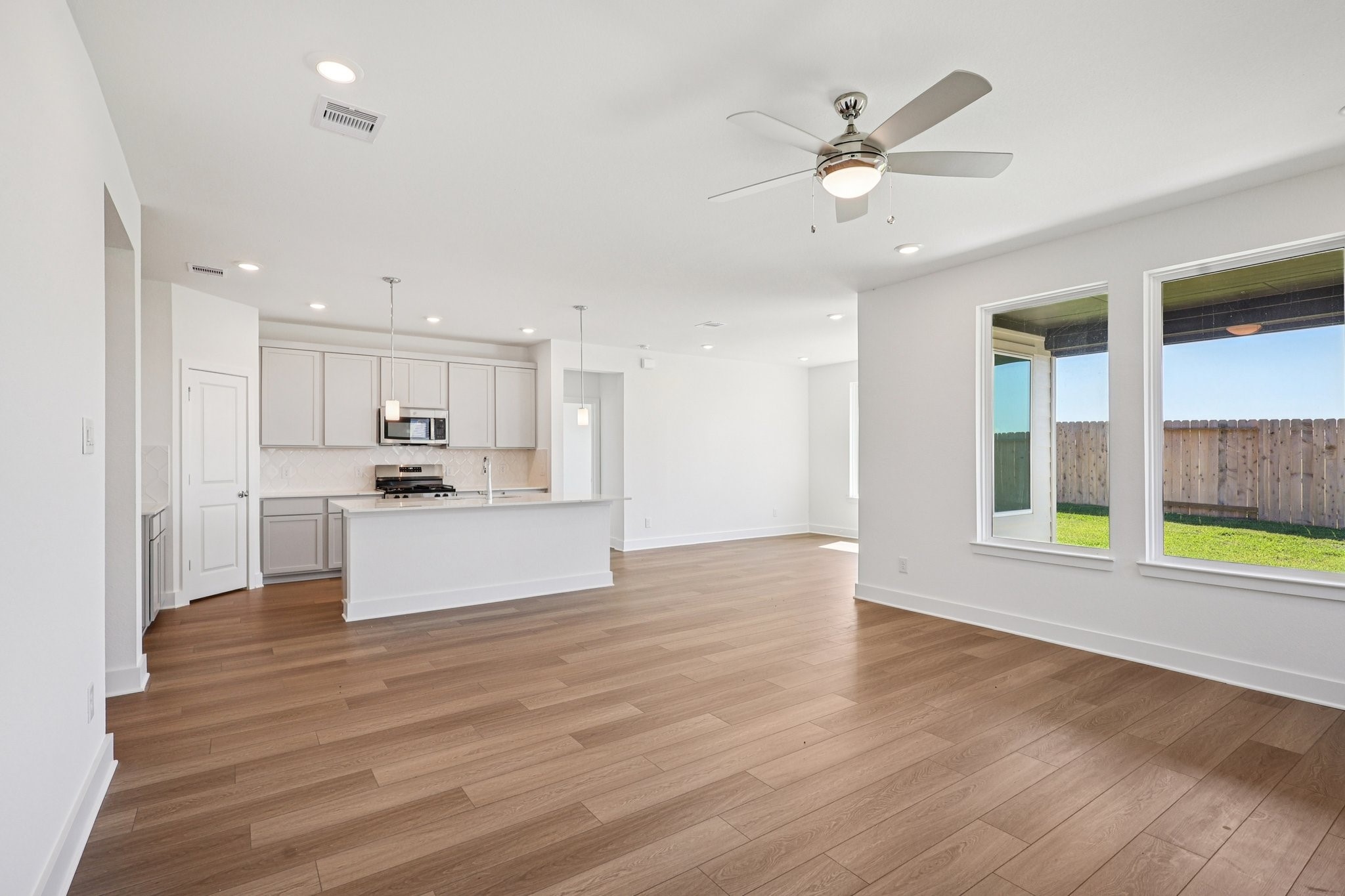 14465 Trumpet Lane Splendora, TX 77372 - Photo 4 of 12 a view of kitchen with sink and wooden floor