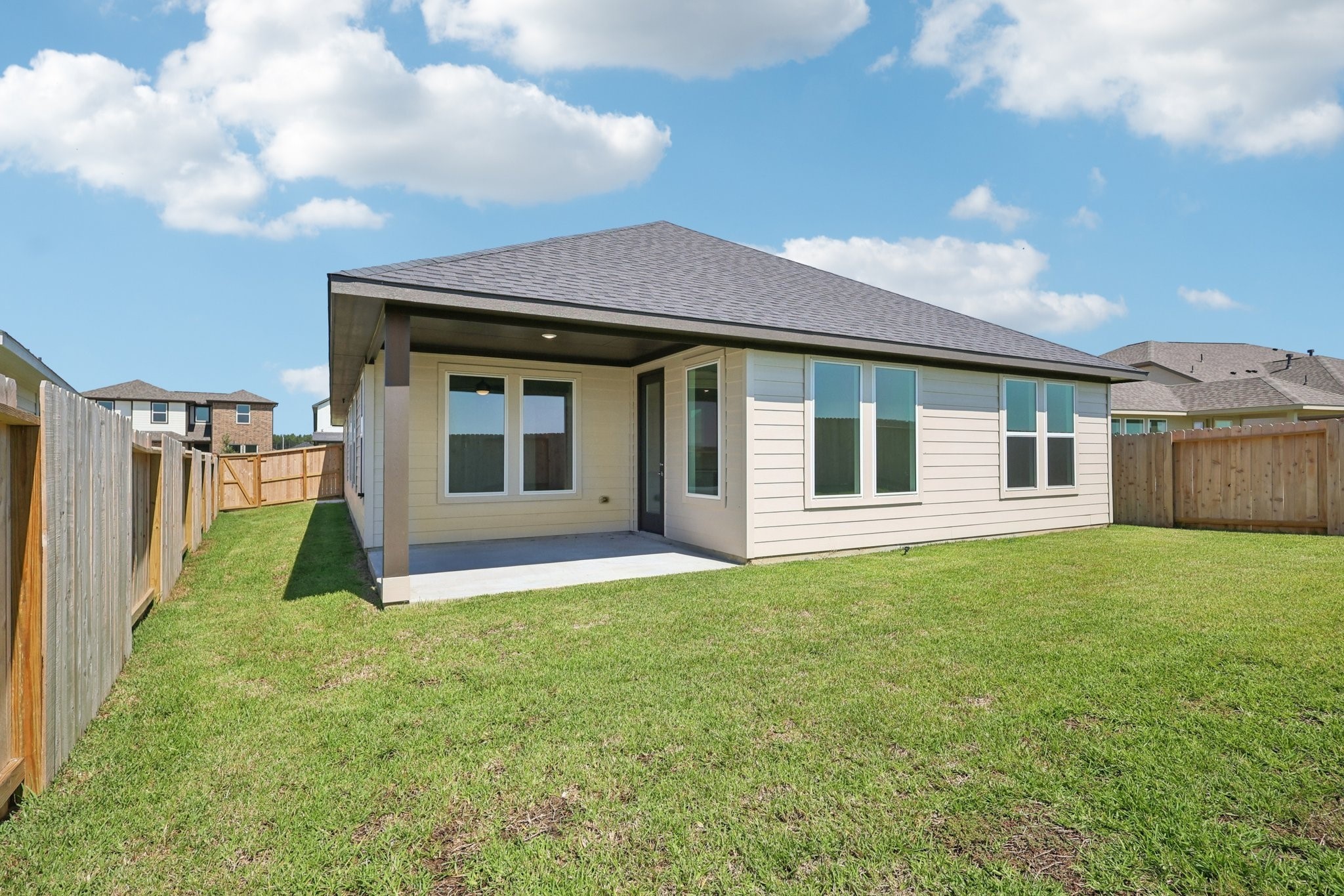 14465 Trumpet Lane Splendora, TX 77372 - Photo 9 of 12 a view of a house with backyard and porch