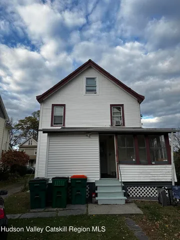 a front view of a house with a garage