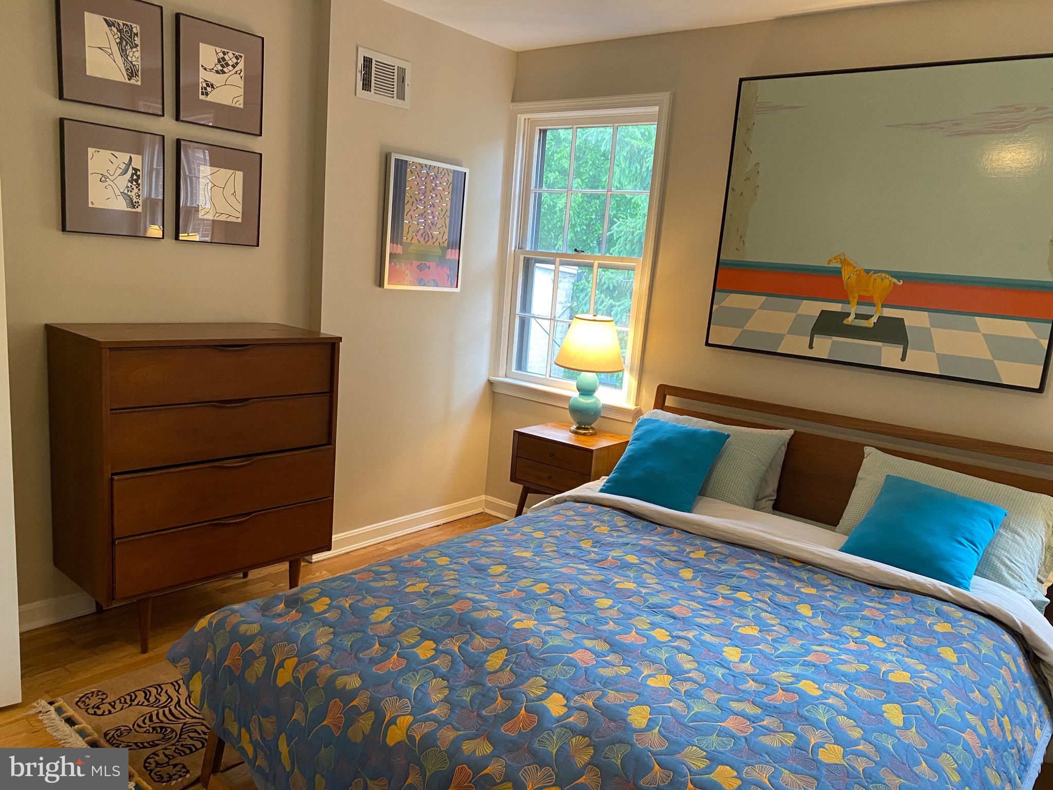 339 11th Street Southeast Washington, DC 20003 - Photo 23 of 39 a bedroom with a bed and wooden floor