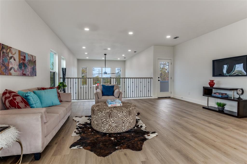 1409 Doyle Avenue Dallas, TX 75203 - Photo 17 of 40 a living room with furniture and a flat screen tv