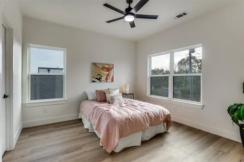 a bedroom with a bed and window