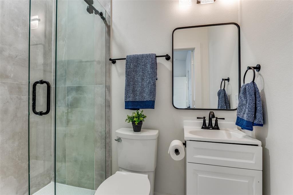 1409 Doyle Avenue Dallas, TX 75203 - Photo 24 of 40 a bathroom with a toilet sink and shower