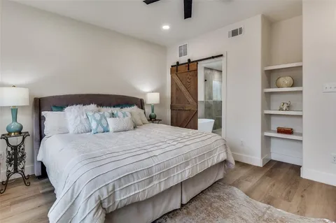 a bedroom with a bed and a walk in closet