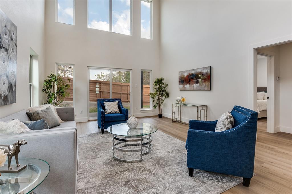 1409 Doyle Avenue Dallas, TX 75203 - Photo 6 of 40 a living room with furniture and a potted plant