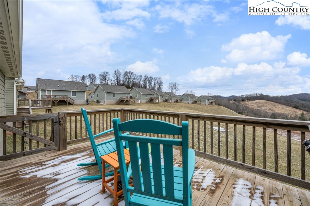 196 Miller Mdw Lane, Unit 38 Boone, NC 28607 - Photo 12 of 32 a view of a balcony with wooden floor & fence