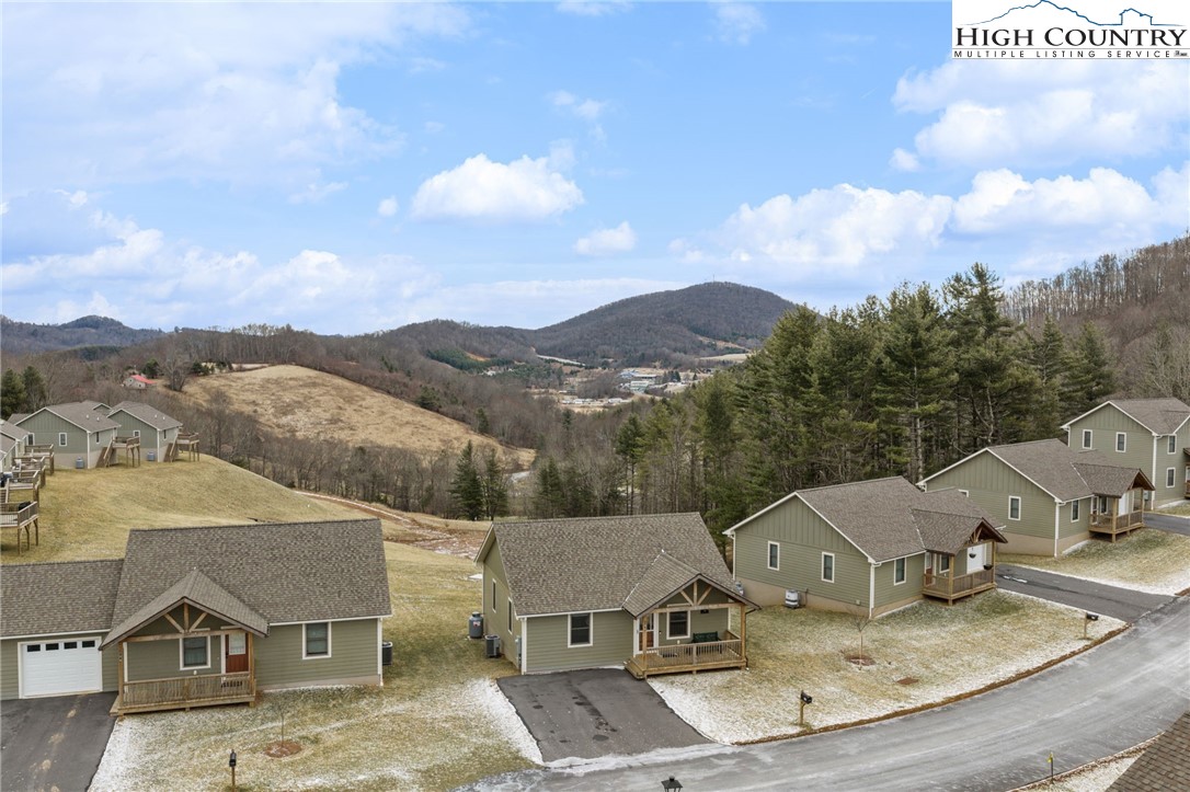 196 Miller Mdw Lane, Unit 38 Boone, NC 28607 - Photo 27 of 32 an aerial view of residential houses with outdoor space