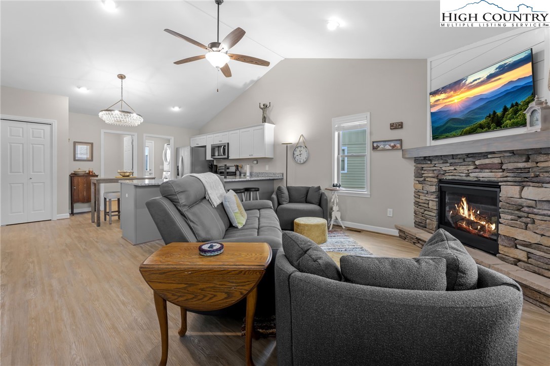 196 Miller Mdw Lane, Unit 38 Boone, NC 28607 - Photo 4 of 32 a living room with furniture and a fireplace