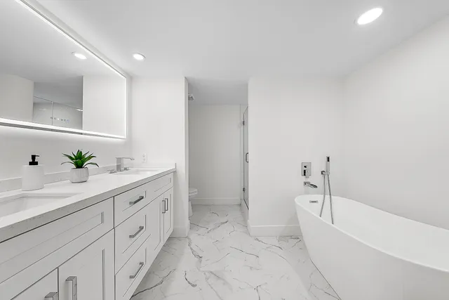 a bathroom with a bathtub sink and toilet