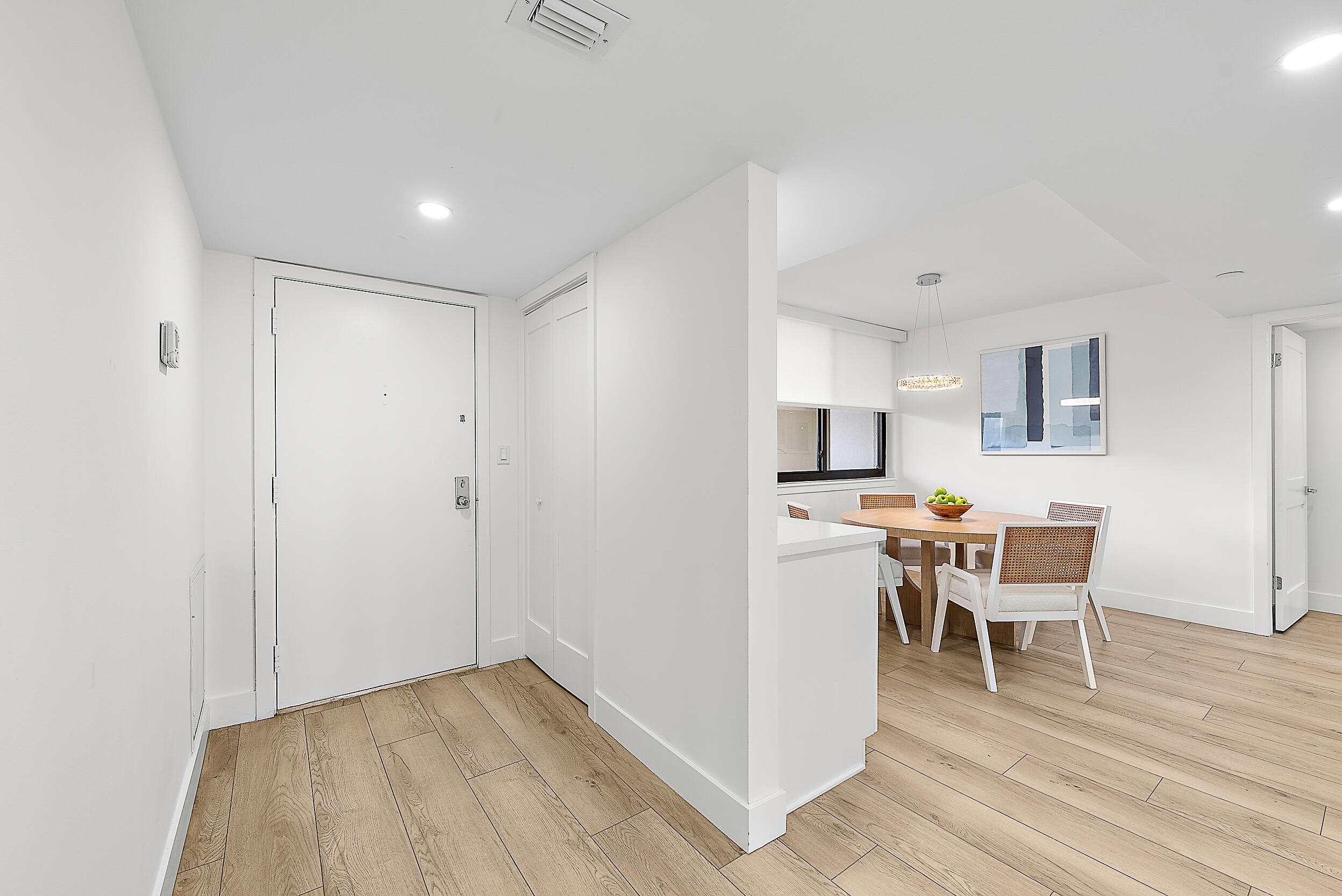 Undisclosed Address Jupiter, FL 33477 - Photo 18 of 28 a view of a dining room with furniture and wooden floor