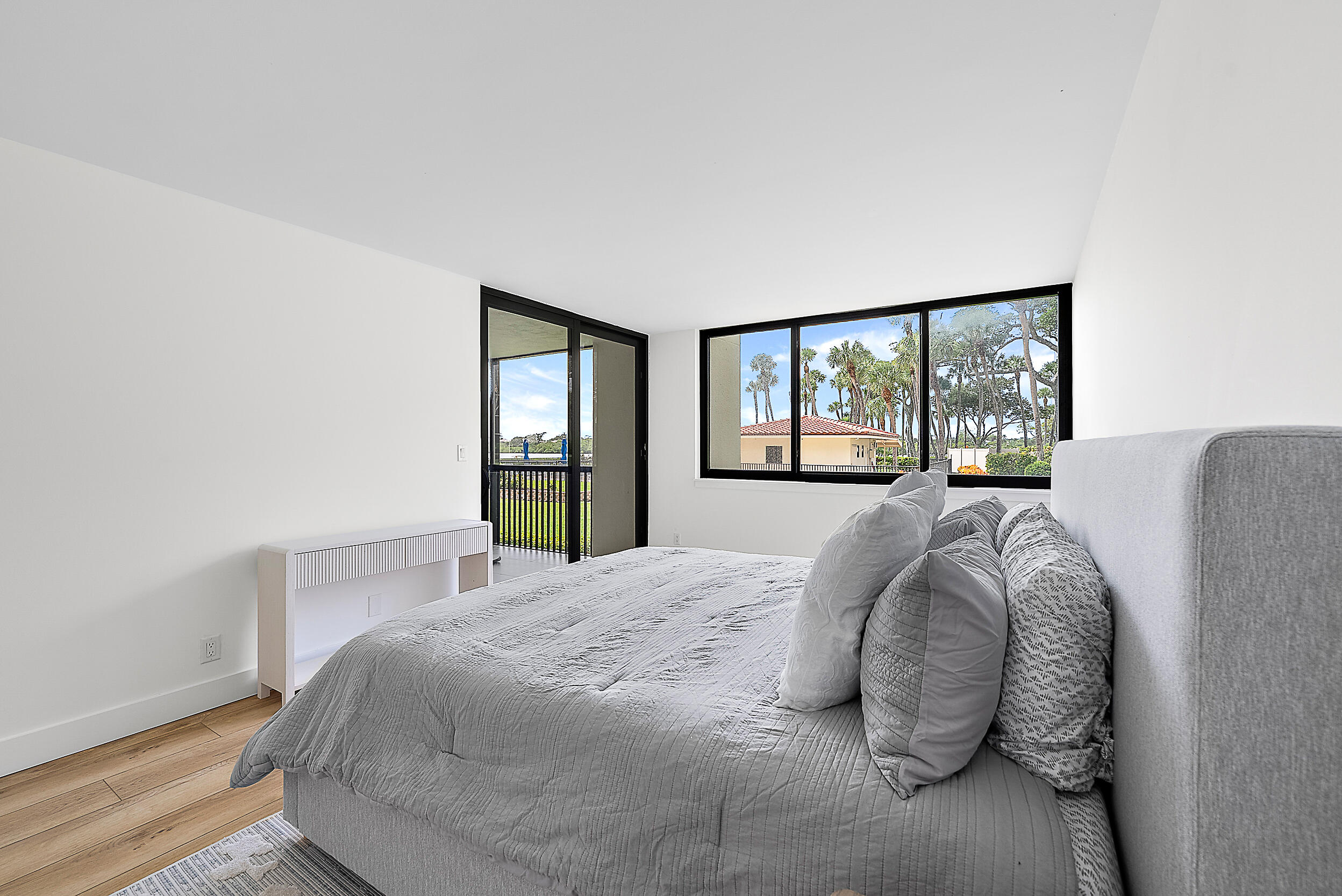 Undisclosed Address Jupiter, FL 33477 - Photo 4 of 28 a bed sitting in a bedroom next to a window