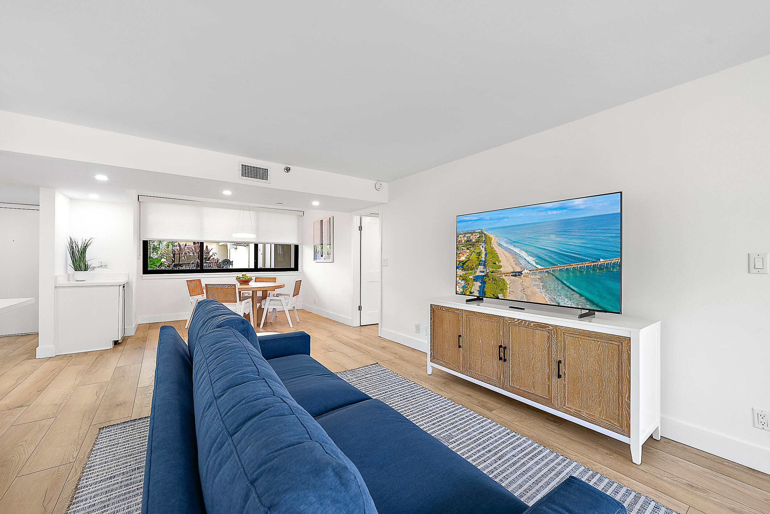 Undisclosed Address Jupiter, FL 33477 - Photo 7 of 28 a living room with furniture and a view of kitchen