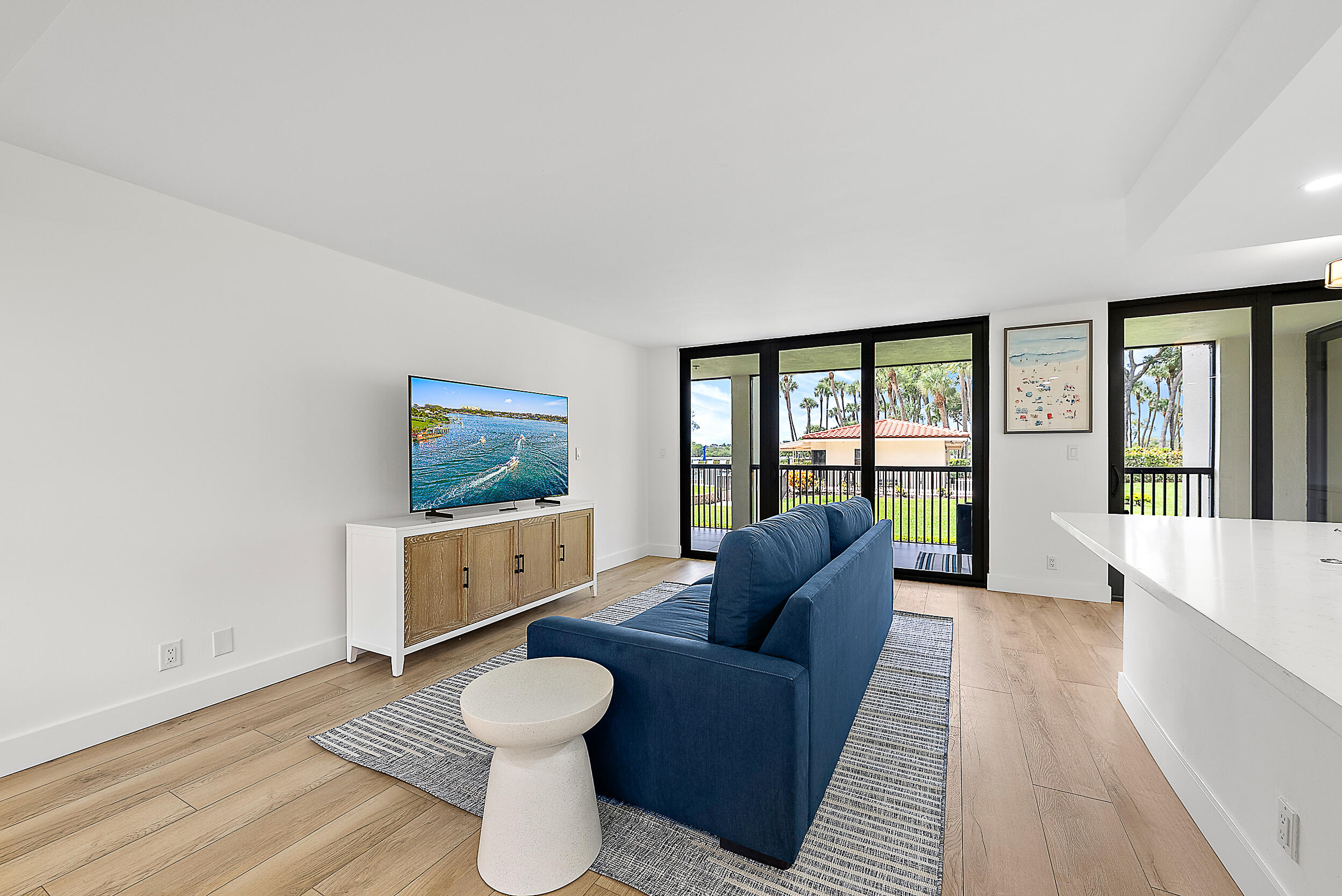 Undisclosed Address Jupiter, FL 33477 - Photo 8 of 28 a living room with furniture and a large window