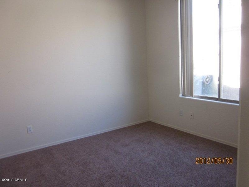 10213 West Payson Road Tolleson, AZ 85353 - Photo 13 of 24 a view of an empty room with a window