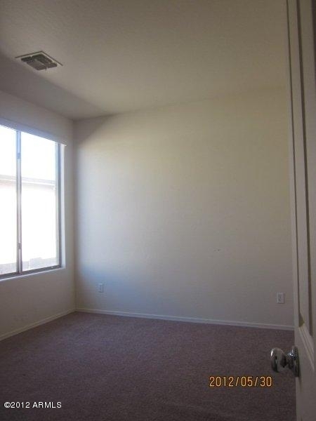 10213 West Payson Road Tolleson, AZ 85353 - Photo 14 of 24 an empty room with window