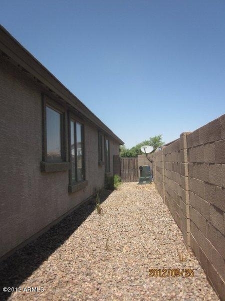10213 West Payson Road Tolleson, AZ 85353 - Photo 21 of 24 a view of backyard with pathway