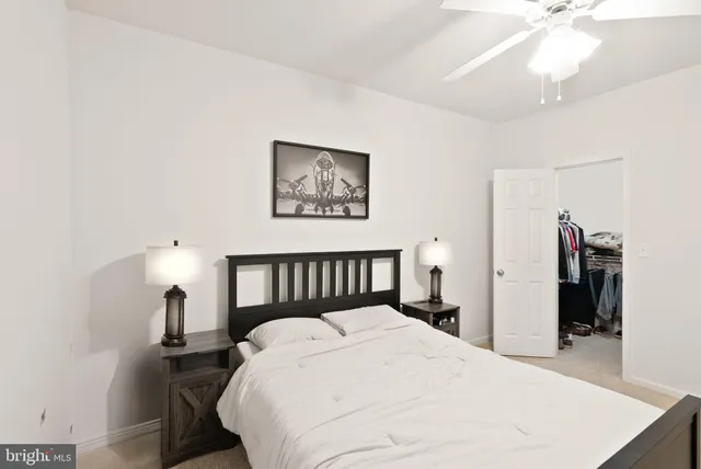 a bed room with a bed and a chandelier