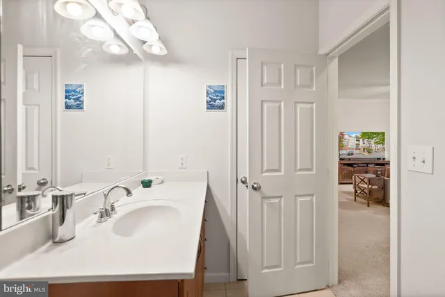 a bathroom with a sink a mirror and shower