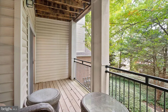 a view of a balcony with furniture