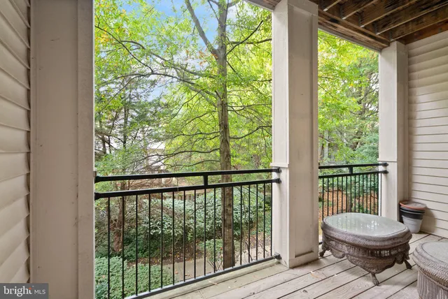 a view of a room with wooden floor and outdoor space