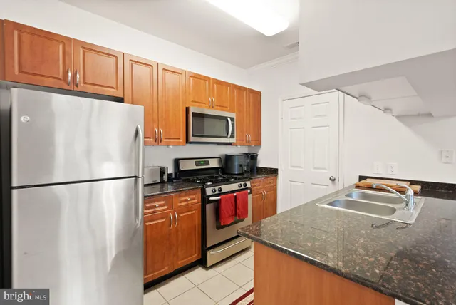 a white refrigerator freezer sitting in a kitchen