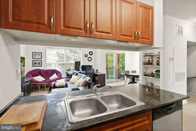 a kitchen with a sink and a stove top oven