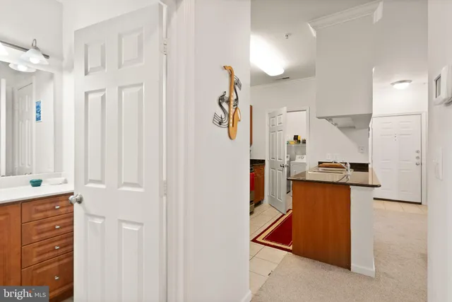 a kitchen with stainless steel appliances granite countertop a stove and a refrigerator