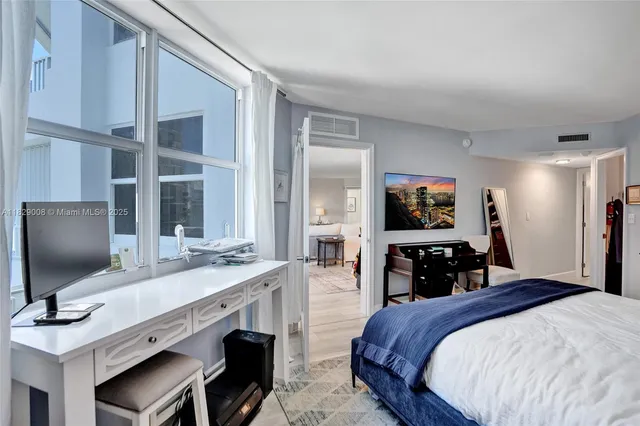 a kitchen with a sink and a large window