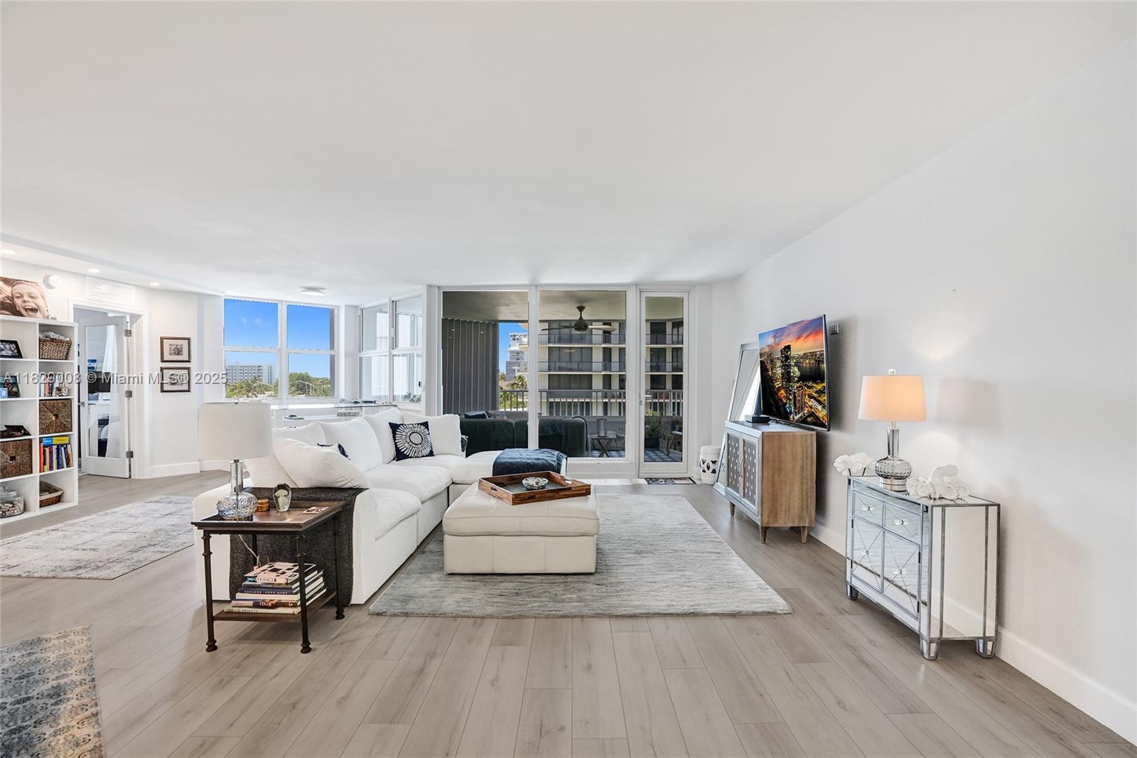 1340 South Ocean Boulevard, Unit 403 Pompano Beach, FL 33062 - Photo 3 of 74 a living room with furniture and a wooden floor