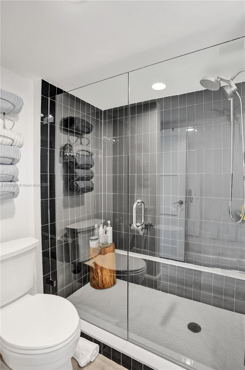 1340 South Ocean Boulevard, Unit 403 Pompano Beach, FL 33062 - Photo 40 of 74 a bathroom with a toilet and a shower