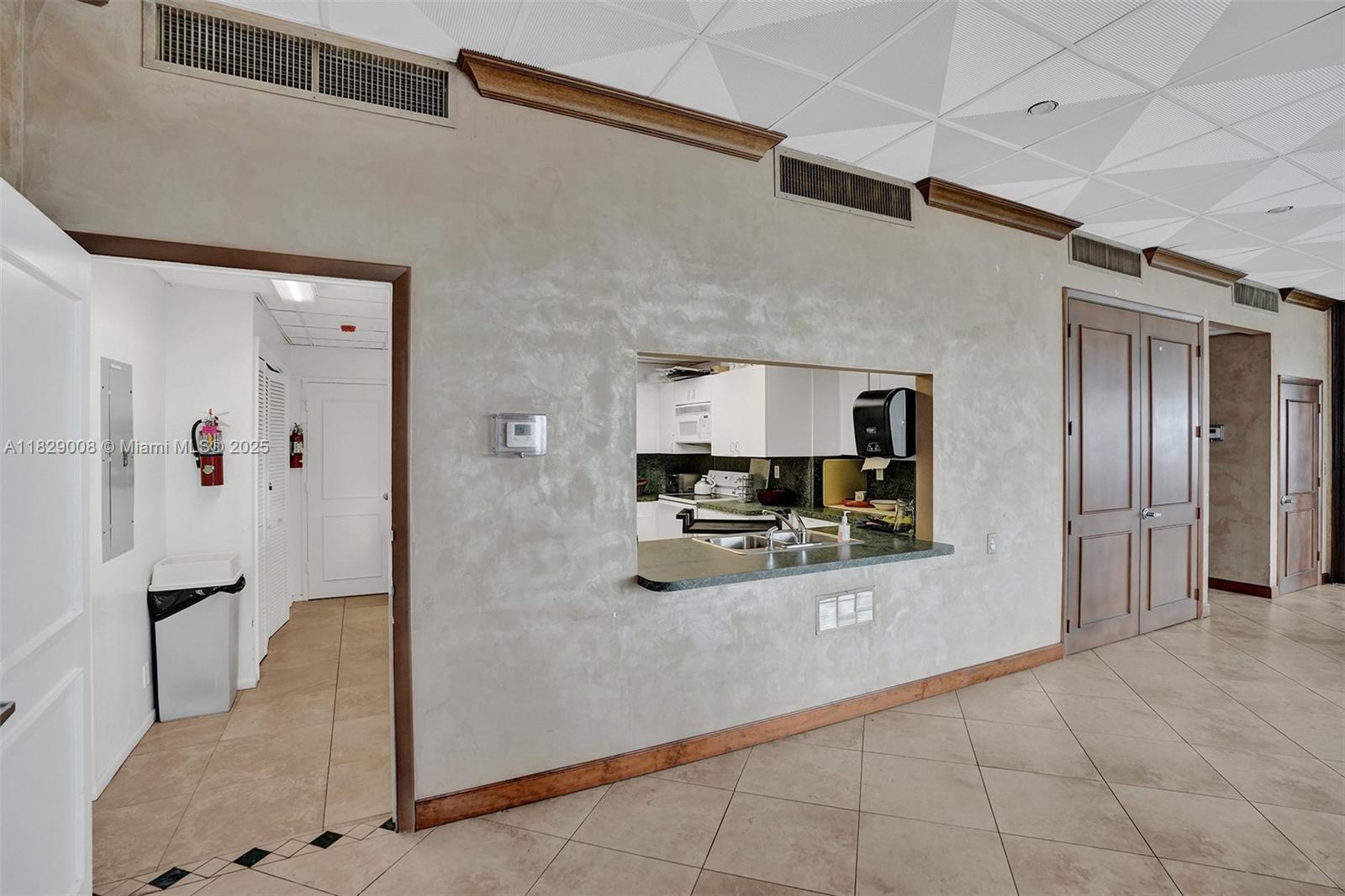 1340 South Ocean Boulevard, Unit 403 Pompano Beach, FL 33062 - Photo 69 of 74 a large kitchen with stainless steel appliances a refrigerator and a counter top space