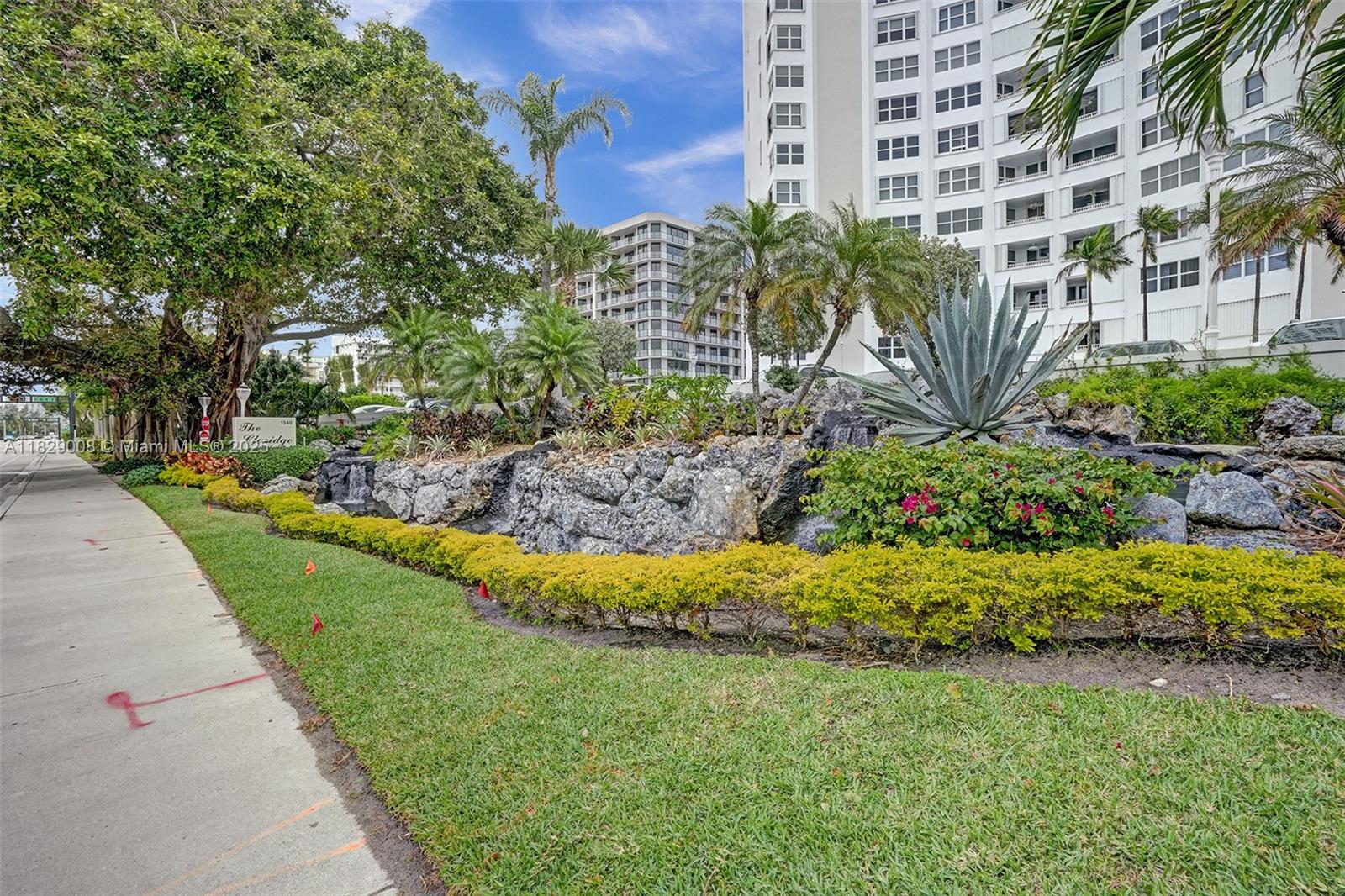 1340 South Ocean Boulevard, Unit 403 Pompano Beach, FL 33062 - Photo 71 of 74 a view of a garden with a building