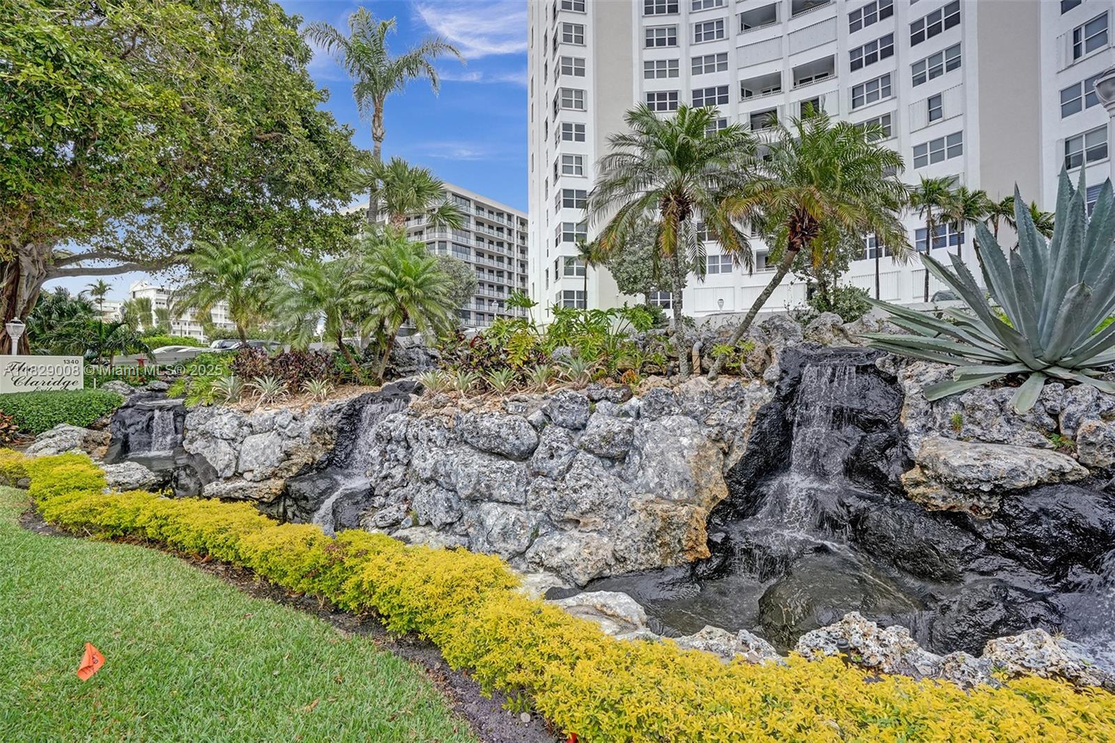 1340 South Ocean Boulevard, Unit 403 Pompano Beach, FL 33062 - Photo 72 of 74 a view of a tall building with a tree in the background