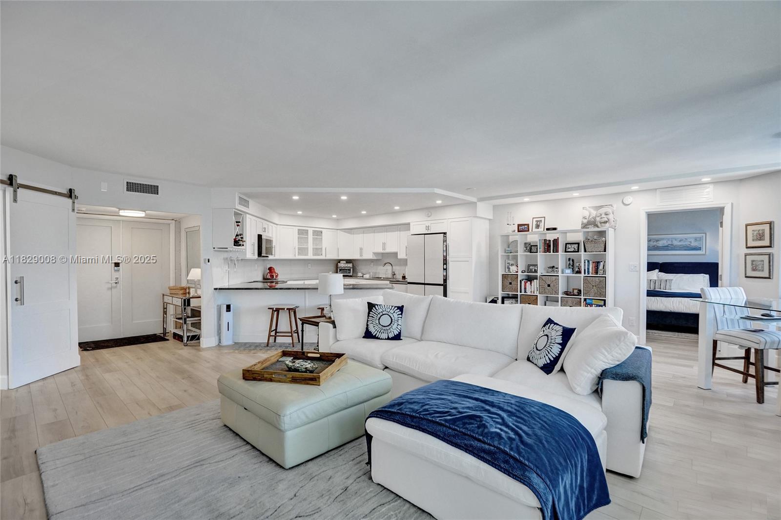 1340 South Ocean Boulevard, Unit 403 Pompano Beach, FL 33062 - Photo 10 of 74 a living room with furniture and view of kitchen